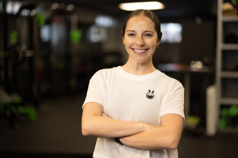 Environmental team portrait of a staff member at a fitness gym