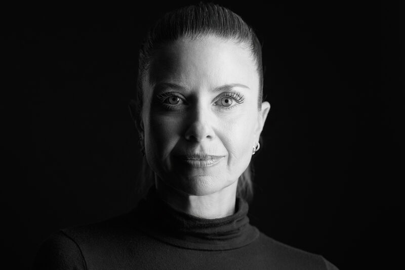 Black-and-white personal branding portrait, studio lighting