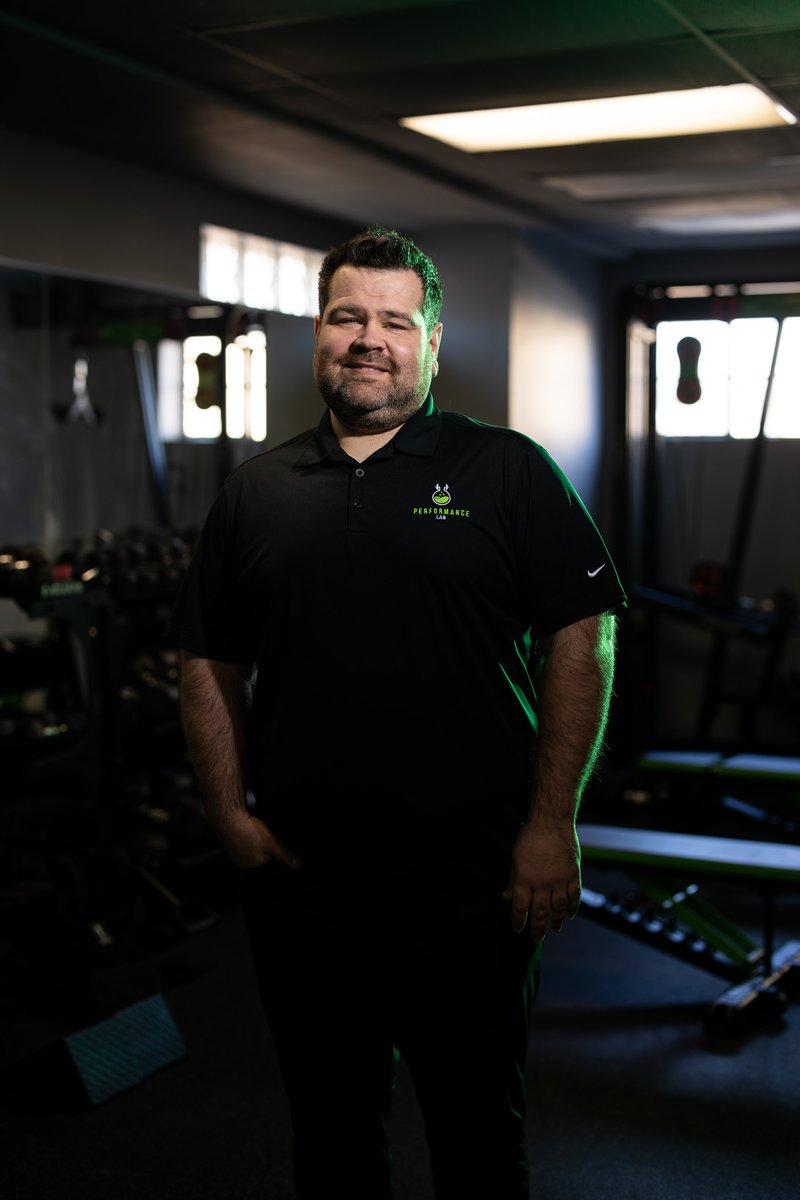 Professional headshot on green background